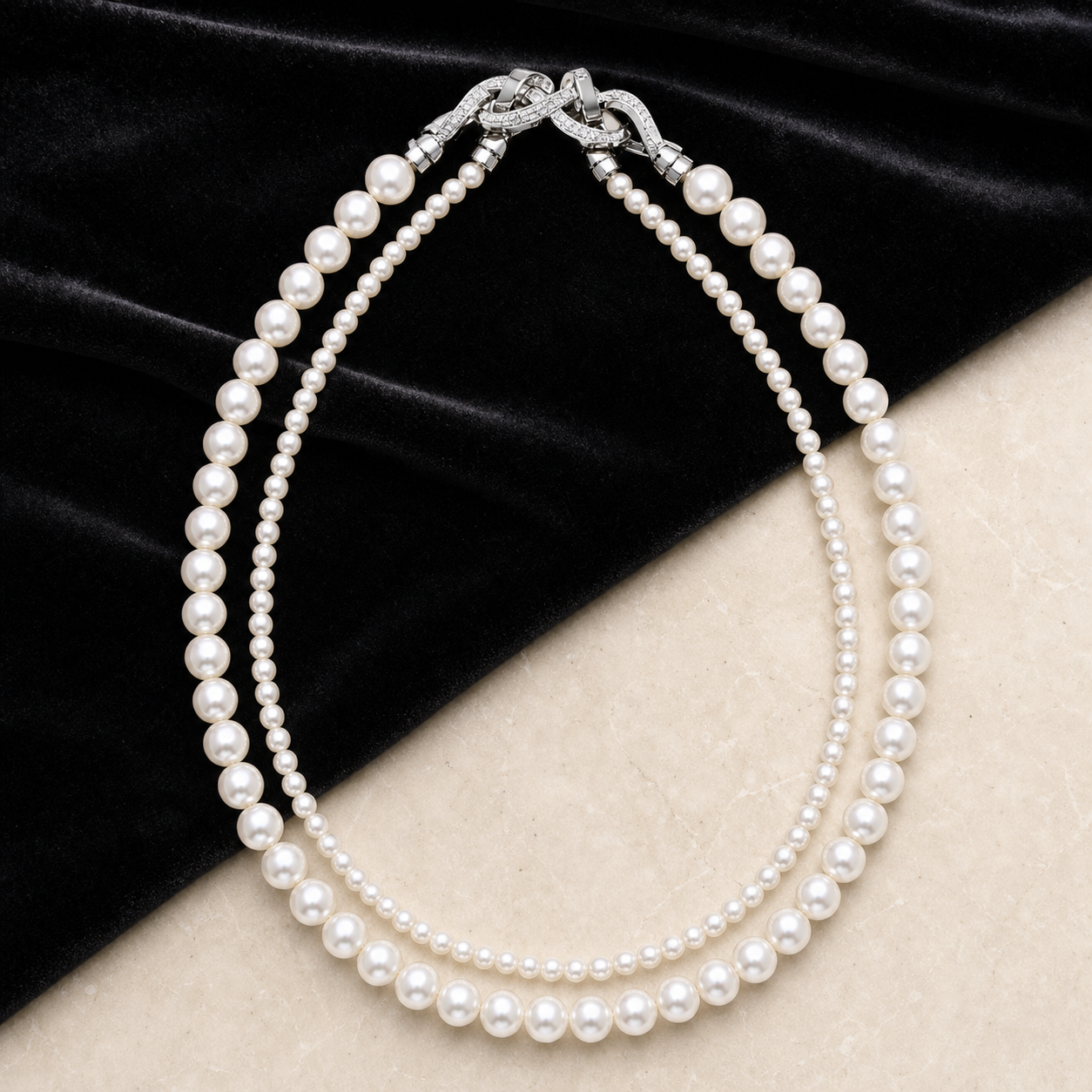 Graduated Pearl Necklace styled on black velvet and ivory stone