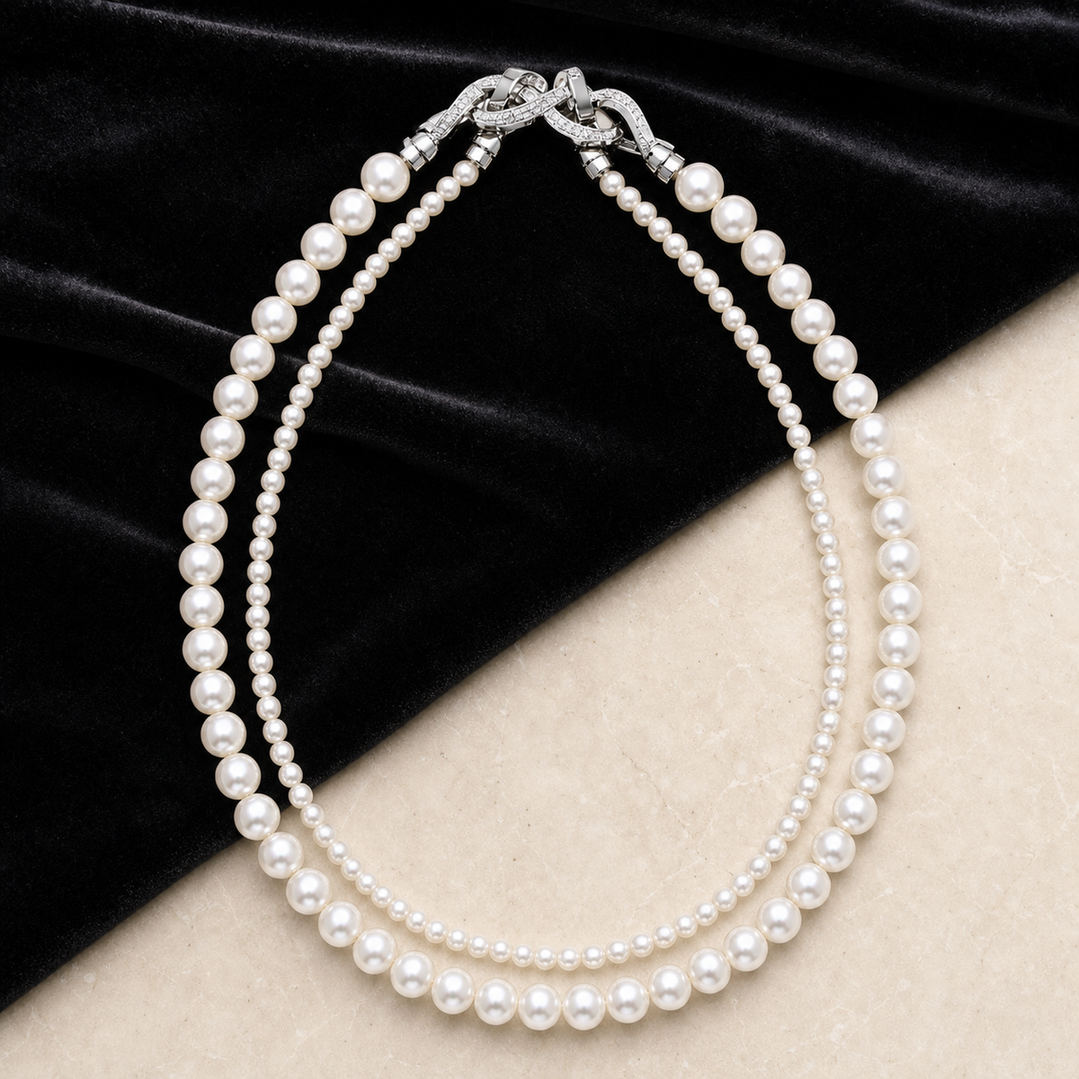 Graduated Pearl Necklace styled on black velvet and ivory stone