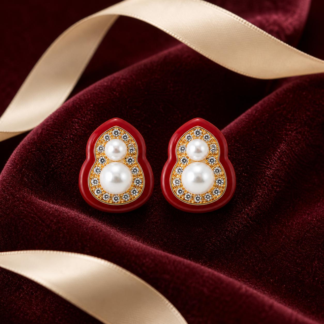 Red Gourd Pearl Stud Earrings styled on burgundy velvet