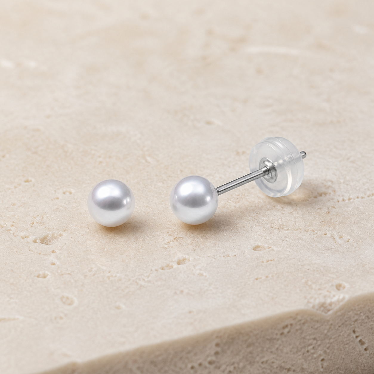 Close-up of Small 3–4 mm freshwater pearl stud earrings