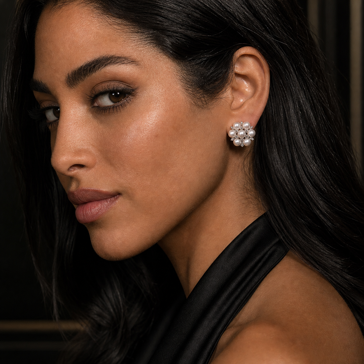 Snowflake freshwater pearl earrings worn for an elegant evening look