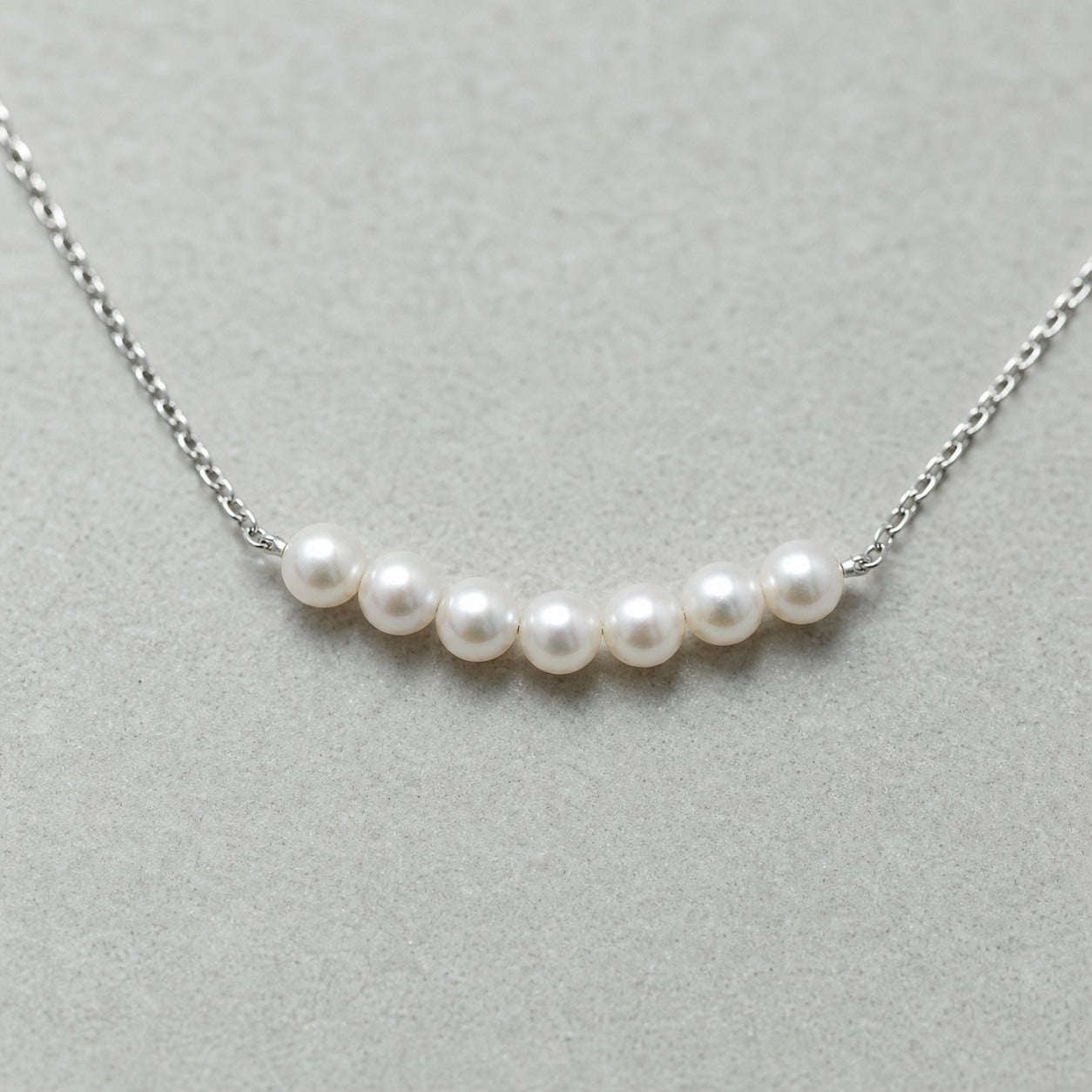 Silver Smile Pearl Necklace close-up showing pearl and metal details